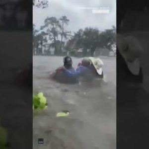Dramatic Rescue Of Elderly Man Stranded In Car During Hurricane Ian