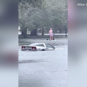 Orlando man paddleboards through flooding from Hurricane Ian