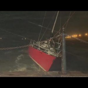 Loose sailboat slams into St. Augustine seawall during Tropical Storm Ian
