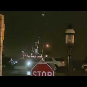 Sailboat pounding against seawall in St Augustine