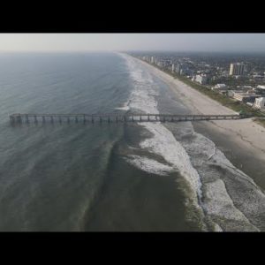 Surfers in Jacksonville Beach enjoy swells brought by Hurricane Fiona
