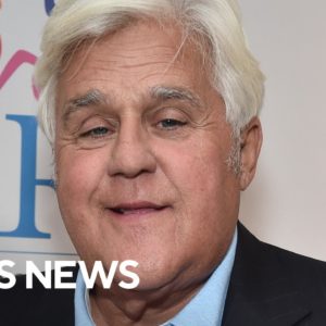 Jay Leno walking around hospital, passing out cookies to children in burn unit