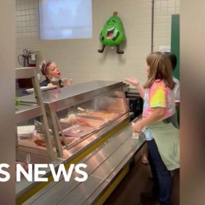 Students learn how to sign to cafeteria worker, who is hard of hearing