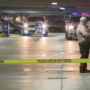 Search for suspects in parking garage shooting continues