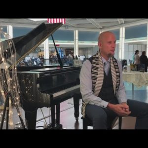 Sing us a song, airport piano man