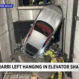 Ferrari gets stuck in elevator shaft at luxury car dealership