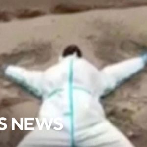 Woman makes ash angel after Russia's Shiveluch volcano erupts