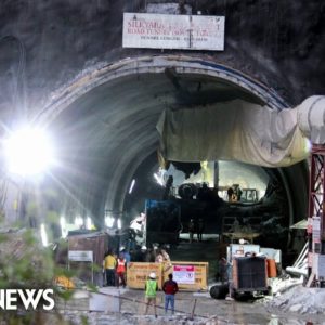 Rescuers race against time to free construction workers trapped in Indian tunnel