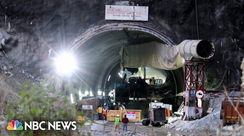 Rescuers race against time to free construction workers trapped in Indian tunnel